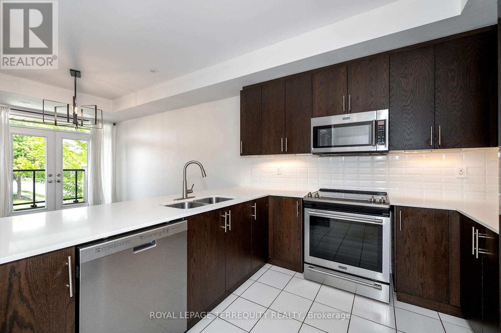 Gorgeous Kitchen with Quartz Counters & B Splash