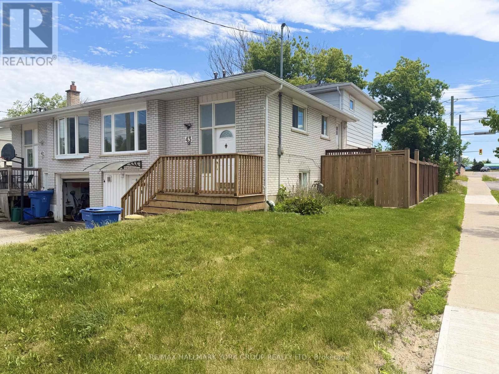upper unit with a private entrance and a backyard