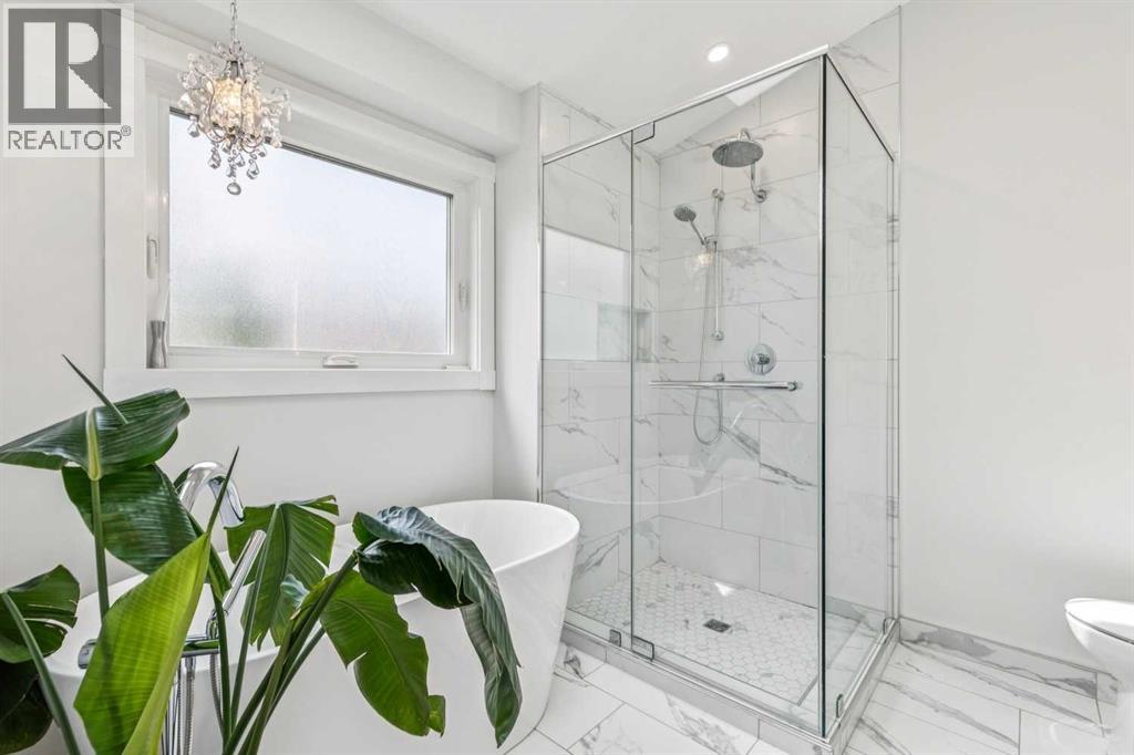 The beautifully updated 5pc en-suite also has heated floors