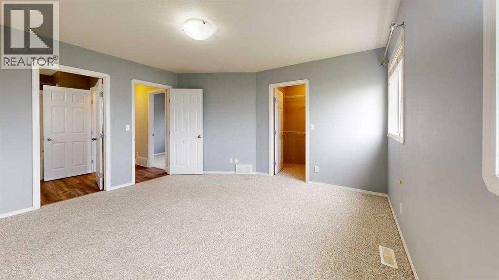primary bedroom upstairs with walk-in closet & direct access to main bathroom