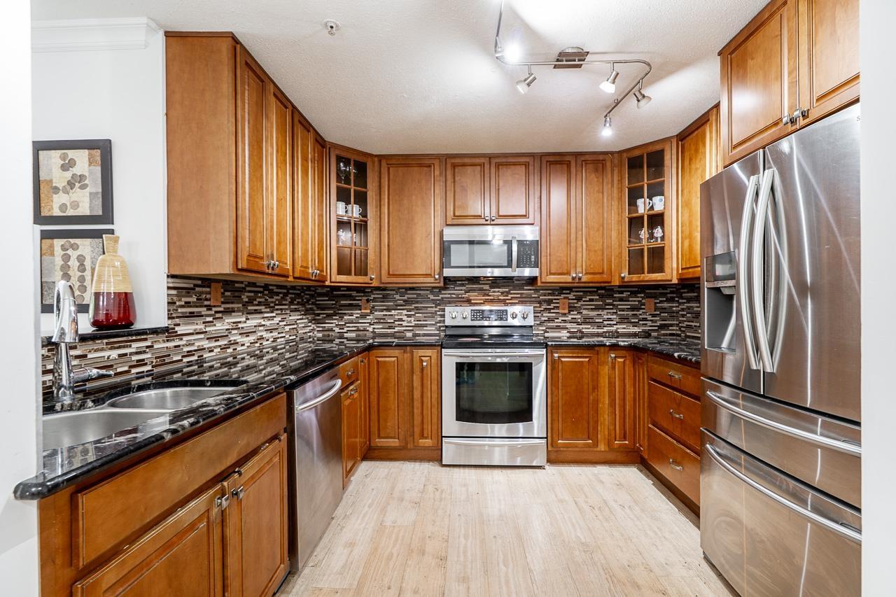 211 20881 56 AVENUE