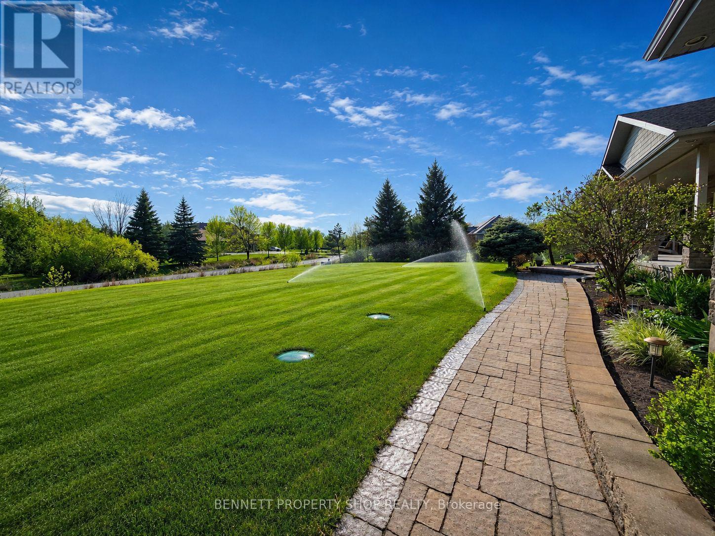 Walkway & Expansive Lawns with Sprinkler System