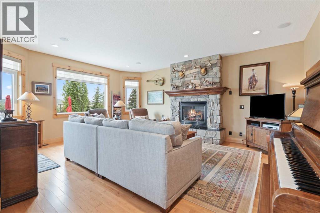 Large picture windows look West to the serene views.  Transom windows bring in additional light