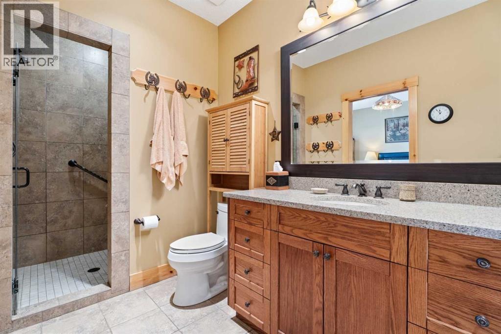 The luxurious ensuite bathroom hosts a gorgeous tile walk-in shower with dual shower heads.  Tuck away everything in the large vanity with plenty of counter space