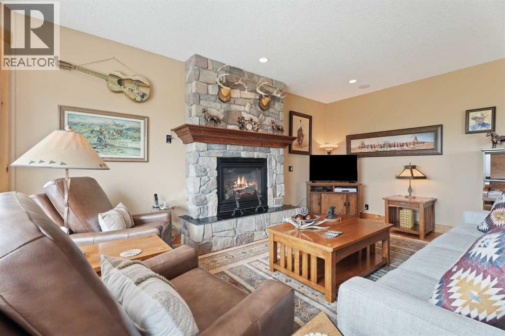 The great room features a gorgeous central gas fireplace, 9' ceilings.  A warm and inviting place to retreat