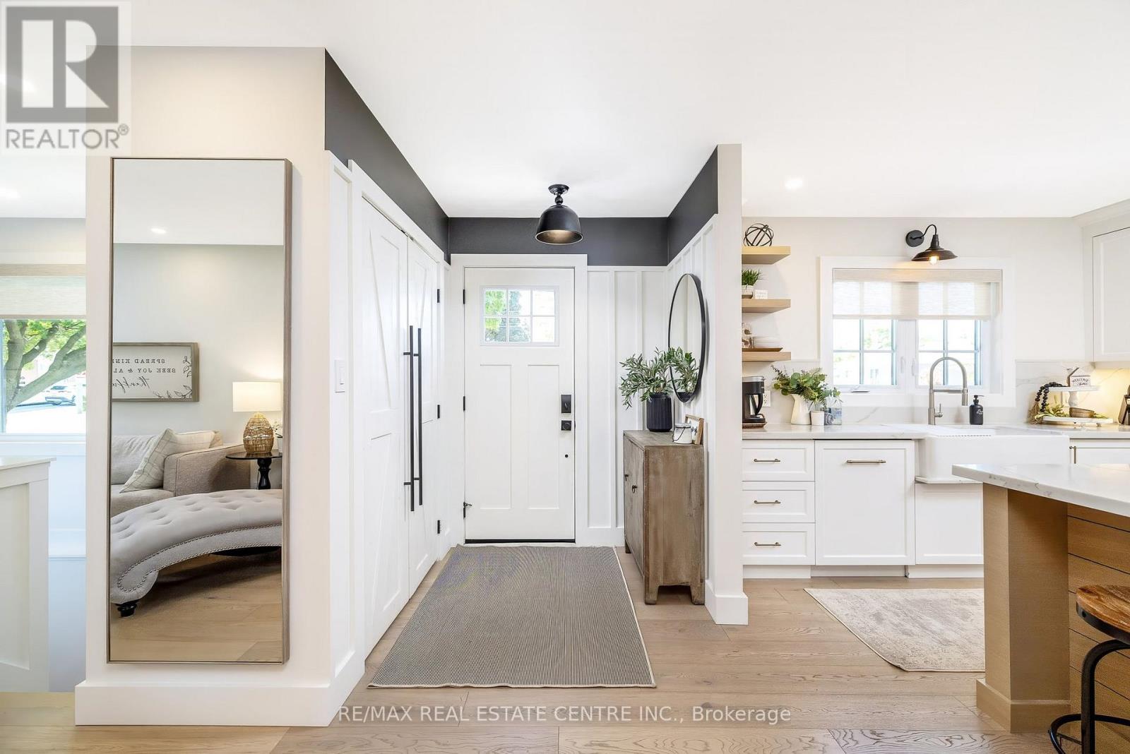 Front entry with large coat closet & custom trim