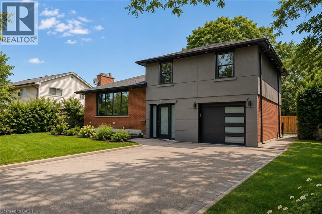 Modern façade featuring a grey stucco and brick exterior