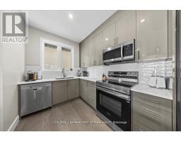 Living room - A & B - 25 Pennard Way, Ottawa, ON K1T4C1 Photo 13
