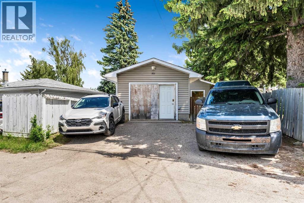 Additional rear parking offers ample space for vehicles, storage, hobbies, or workshop use