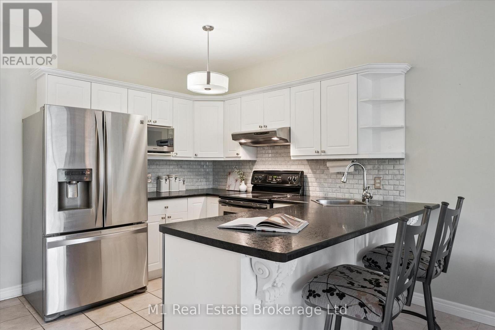 #207 60 WYNDHAM STREET S - 22