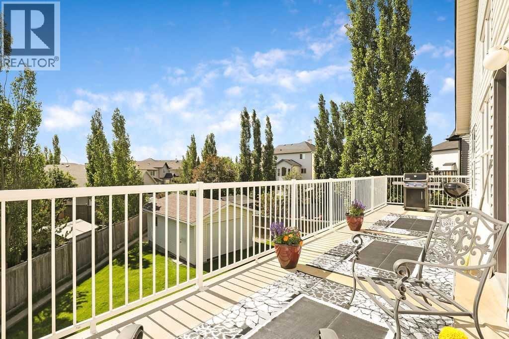 The back deck looks out over the mature trees and big sky.  Enjoy the bird song and the breeze on this expansive deck