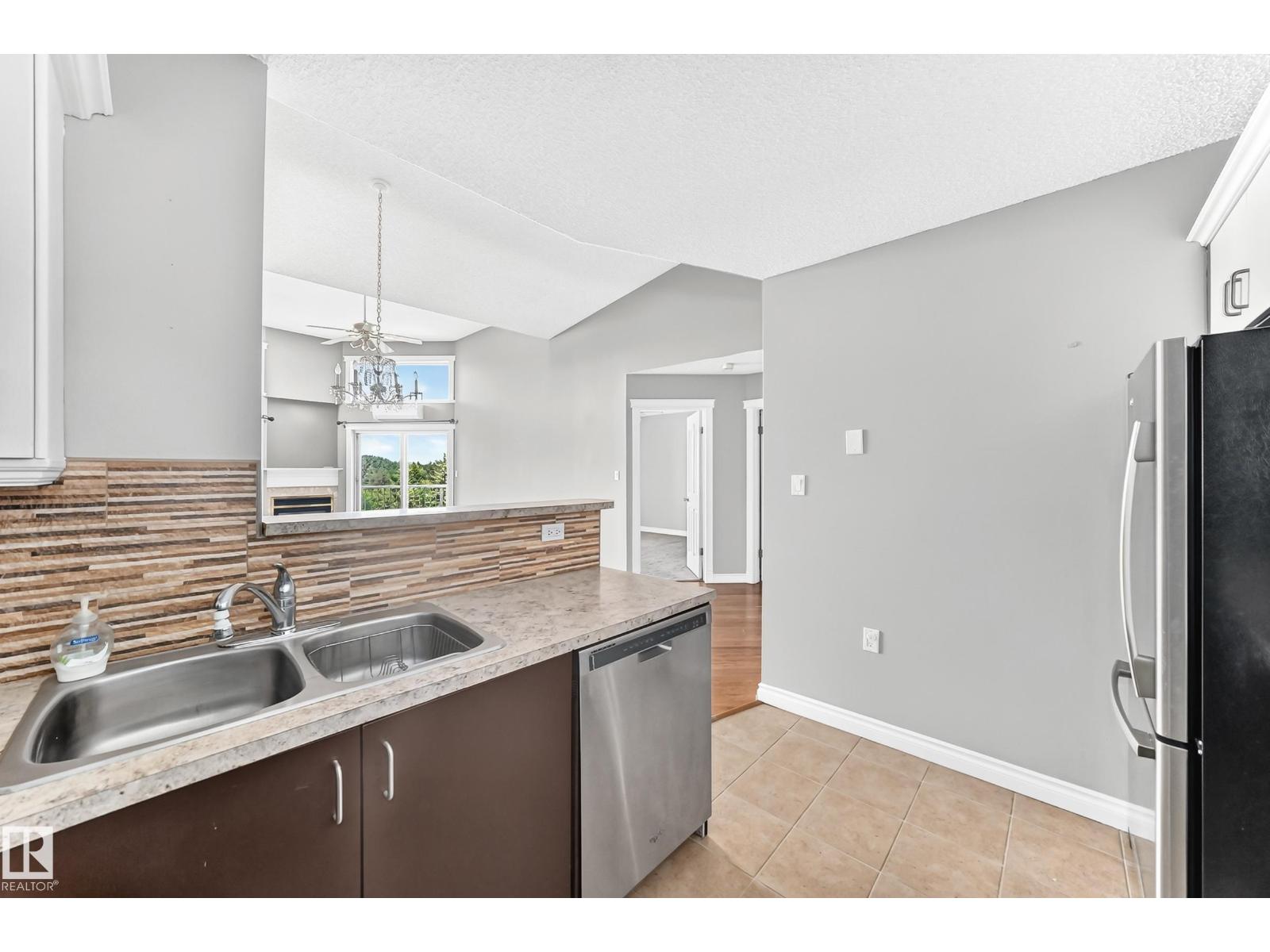 #422 15499 CASTLE DOWNS RD NW - 19