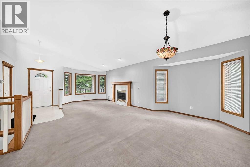 Looking back toward the foyer, the living room and the fireplace