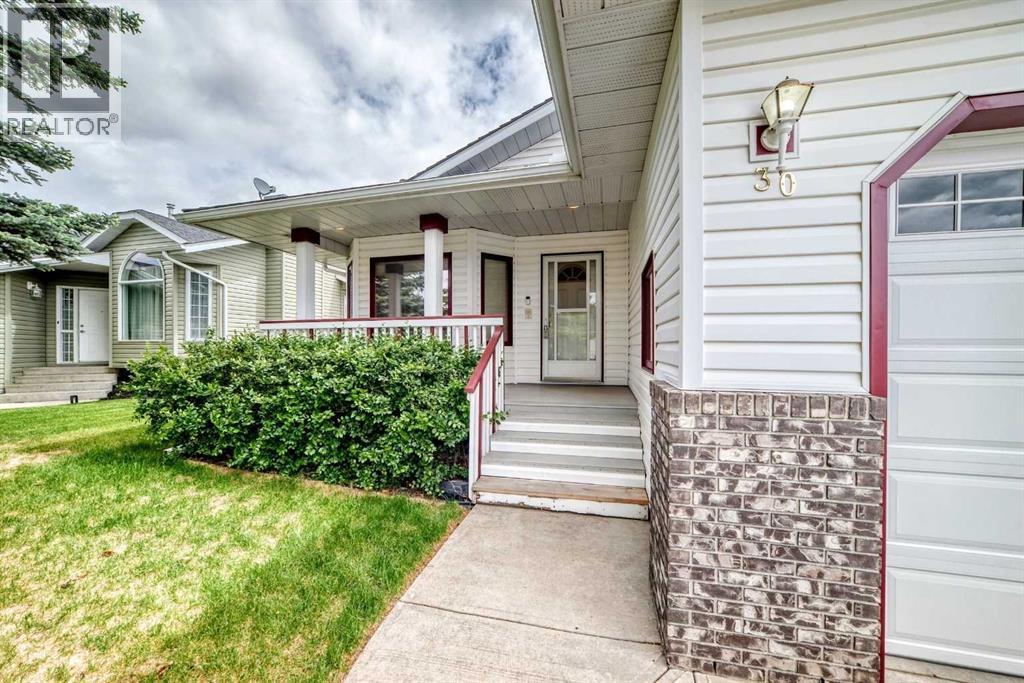 Front west-facing deck. Entering the front entrance of the 1448.6 sq. ft. main floor bungalow