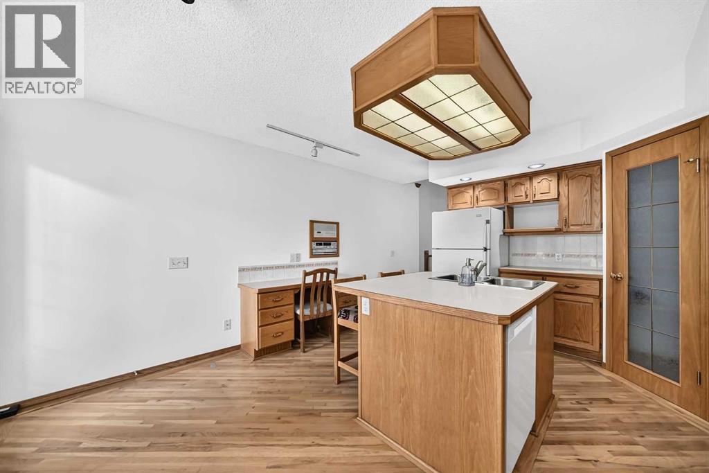 Another look at the heart of the home, showcasing the generous storage and clever built-in desk area