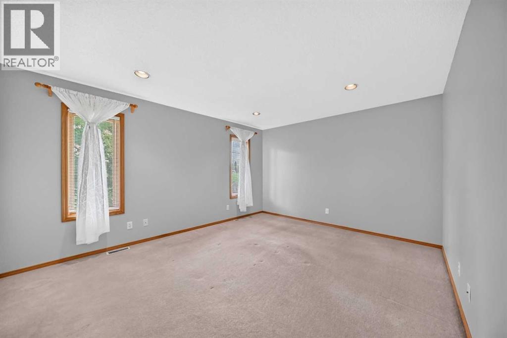 The primary/master bedroom with a three-piece ensuite & the walk-in closet