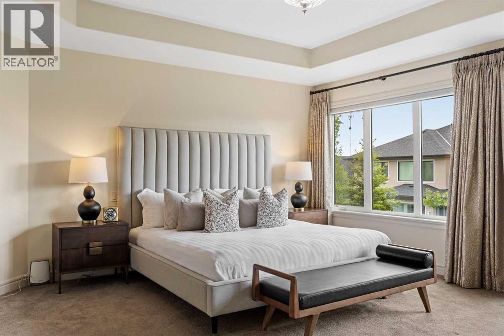 Primary bedroom with a tray ceiling