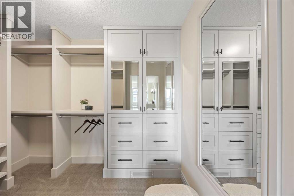 Custom built-in primary walk-in closet