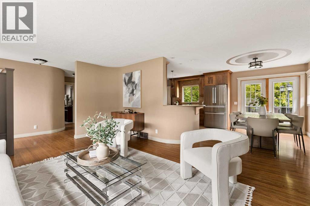Living room open to dining and kitchen