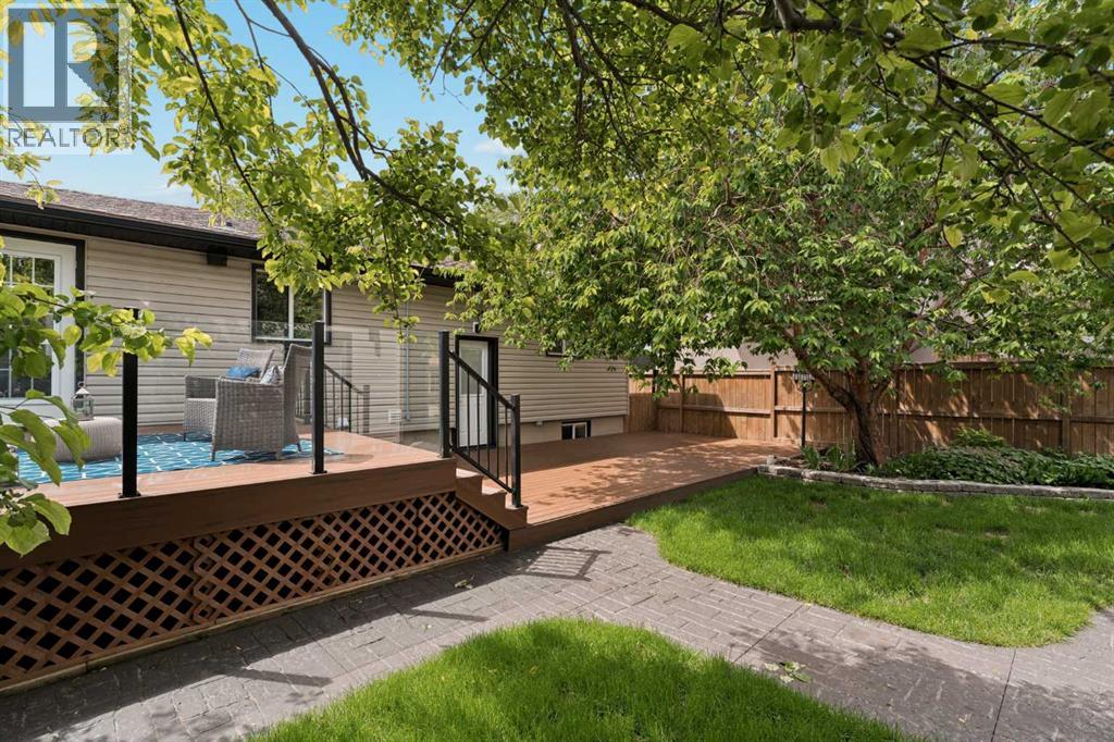 An amazing, beautiful backyard with another massive composite deck to enjoy