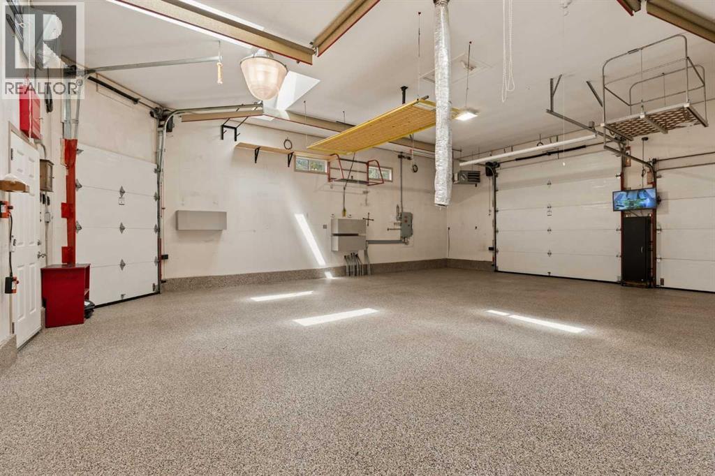 Welcome to every person's DREAM GARAGE with a ton of space and even TWO heaters!