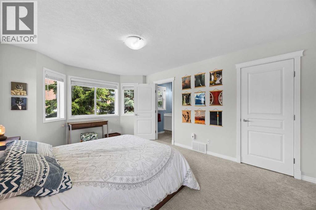 A serene primary retreat with room to unwind, a dedicated reading or work nook, and direct access to the ensuite