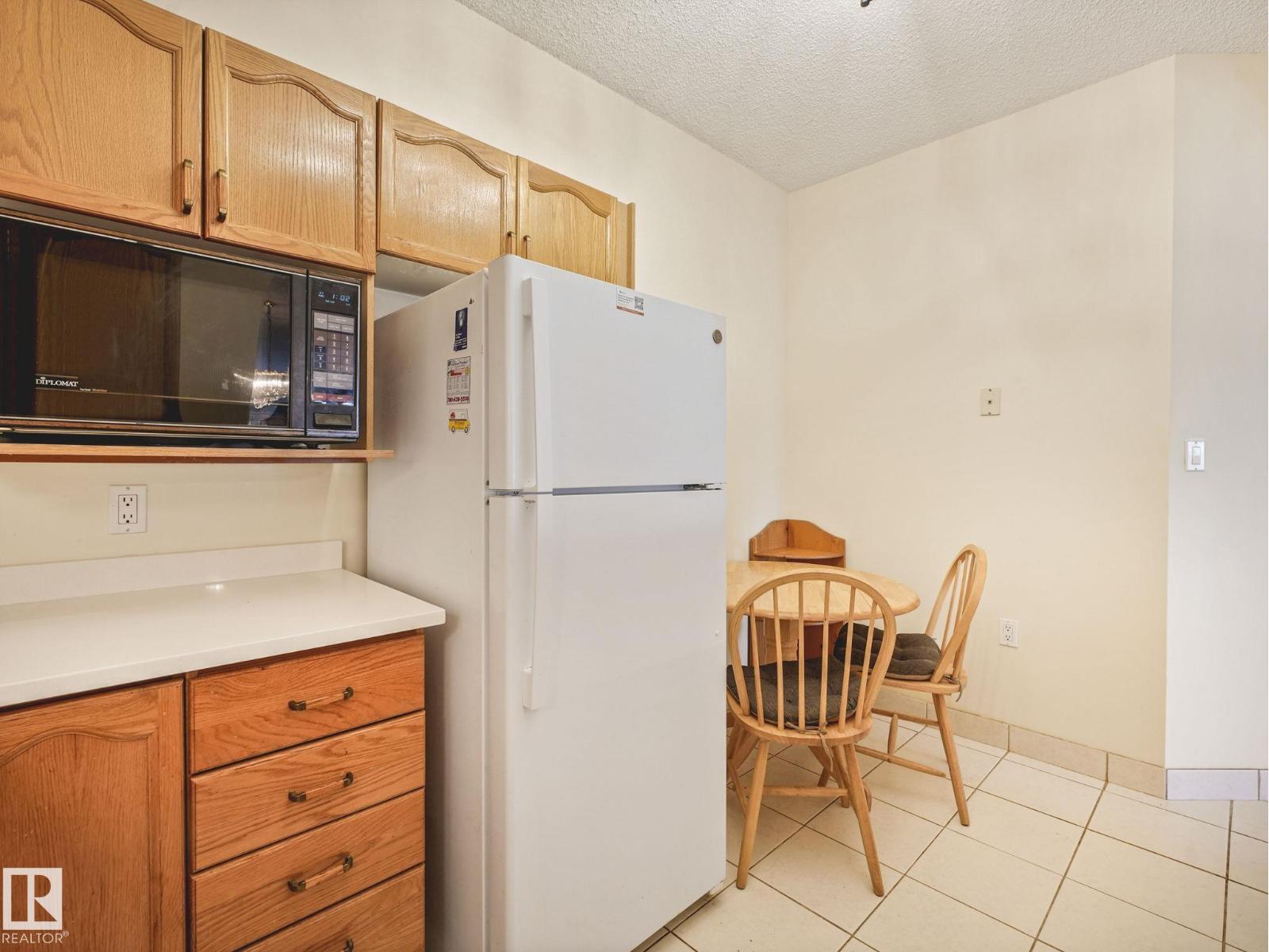 #330 15499 CASTLE DOWNS RD NW — photo 22