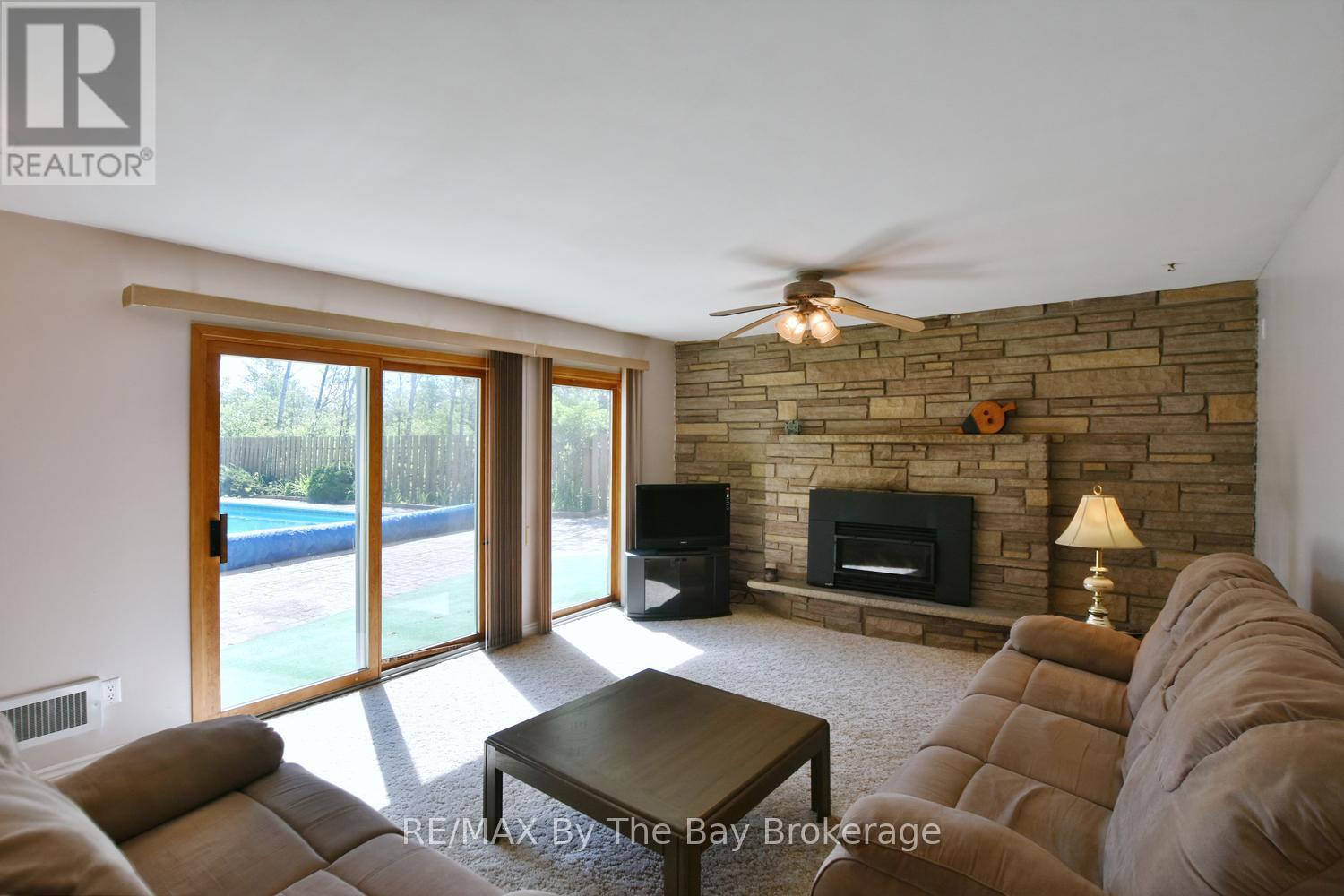 Rec Room With Patio Doors to Backyard and Pool