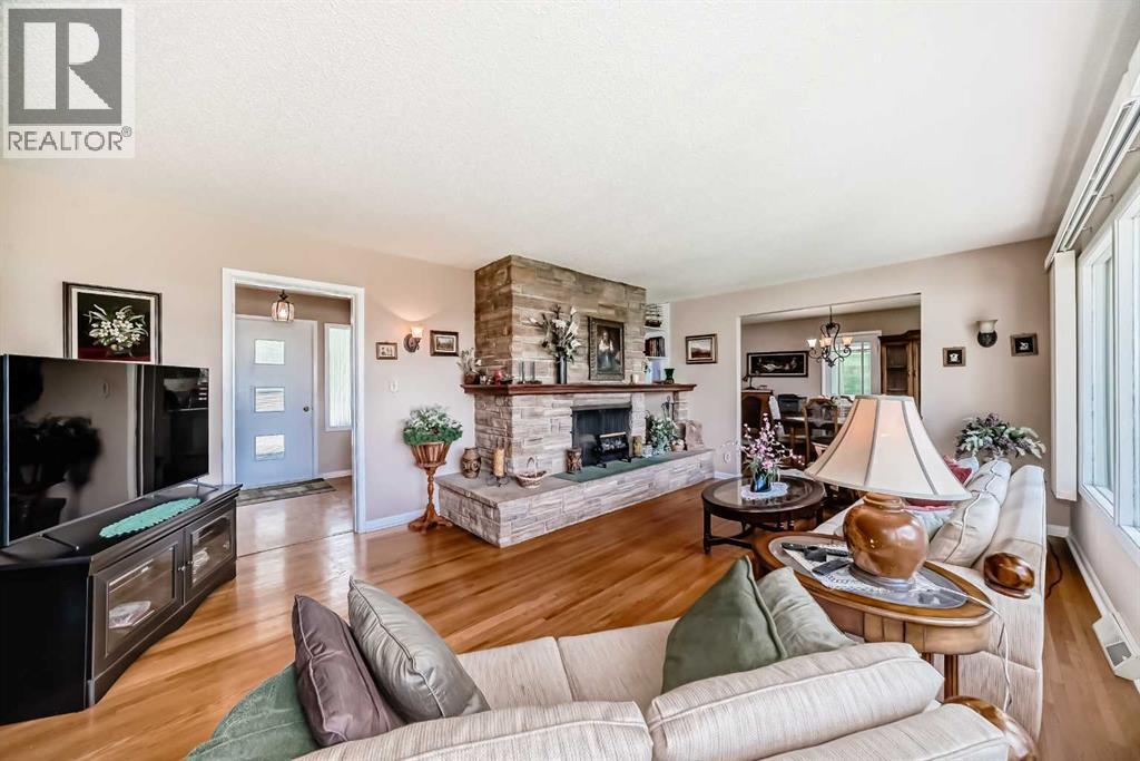 Showing the wood burning fireplace in the living room