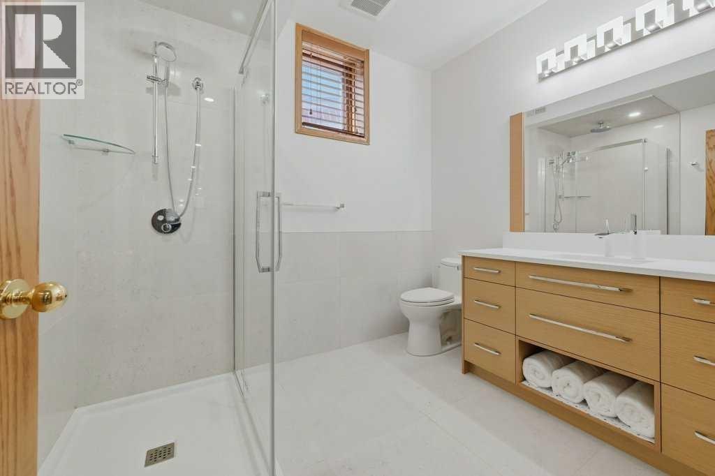 Renovated 3 piece basement bathroom with heated floors