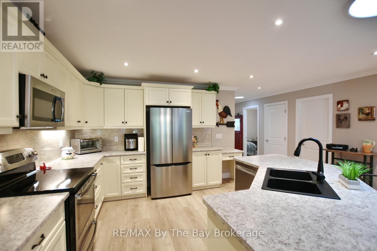 Large Kitchen with Island and Stainless Appliances