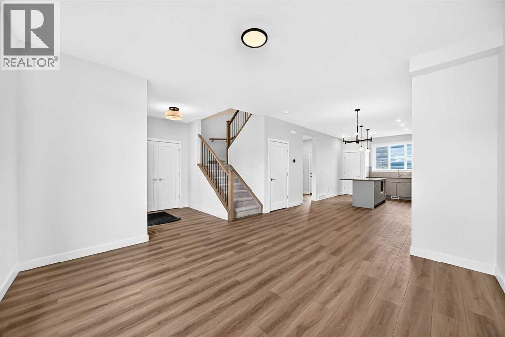 Living Room View to Front Entry & Dining Area
