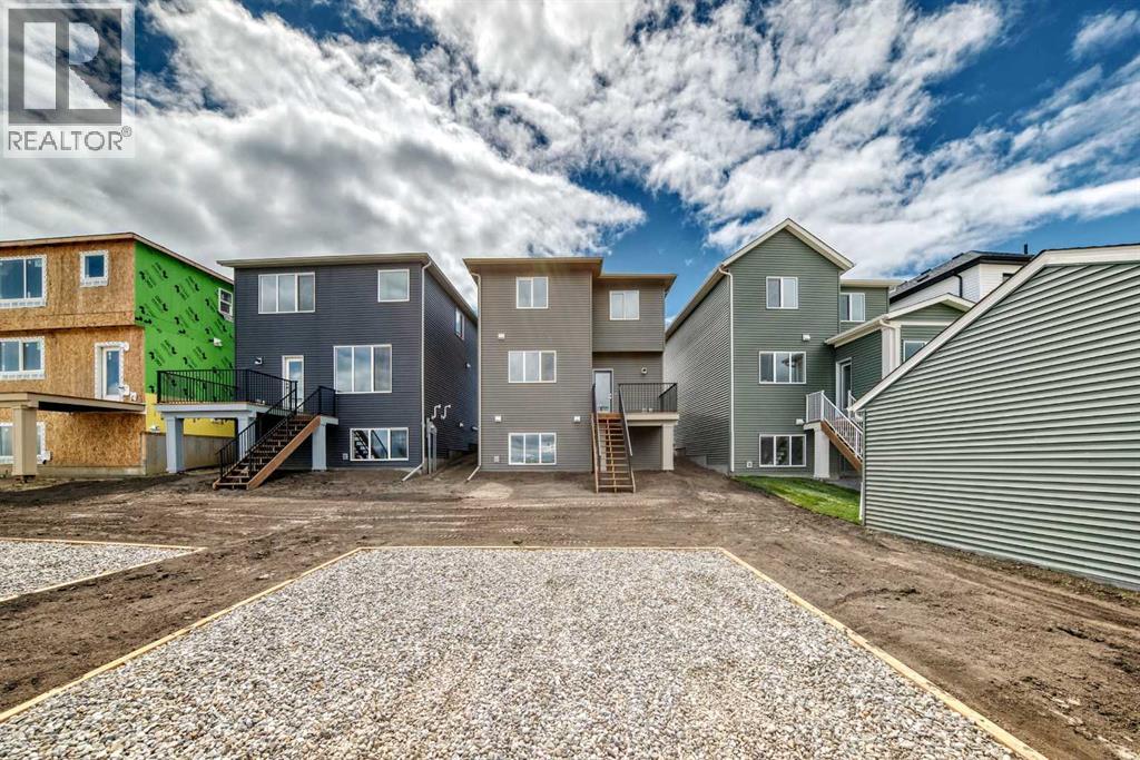 Two-Car Parking Pad & Rear of Home