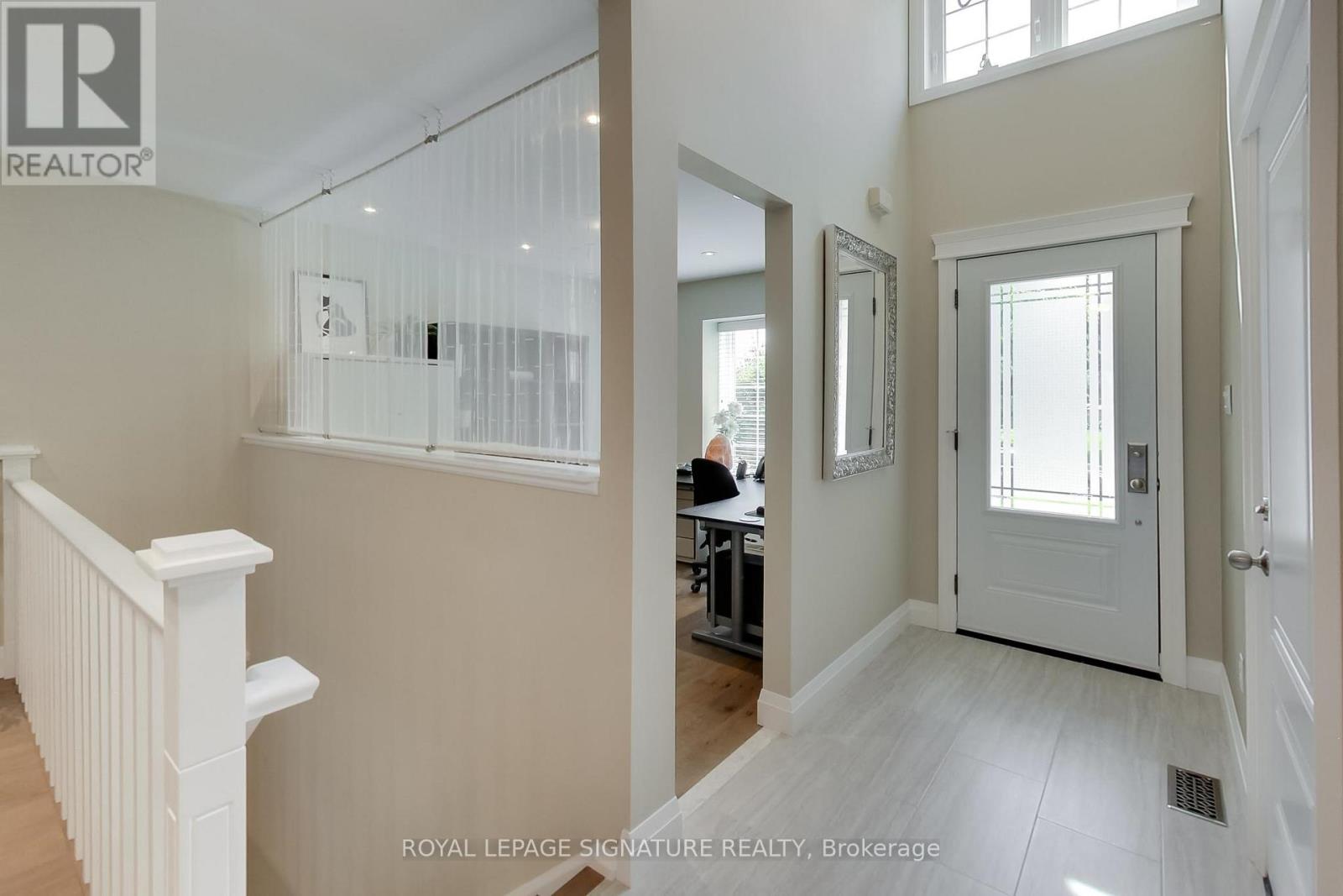Foyer with vaulted dormer window