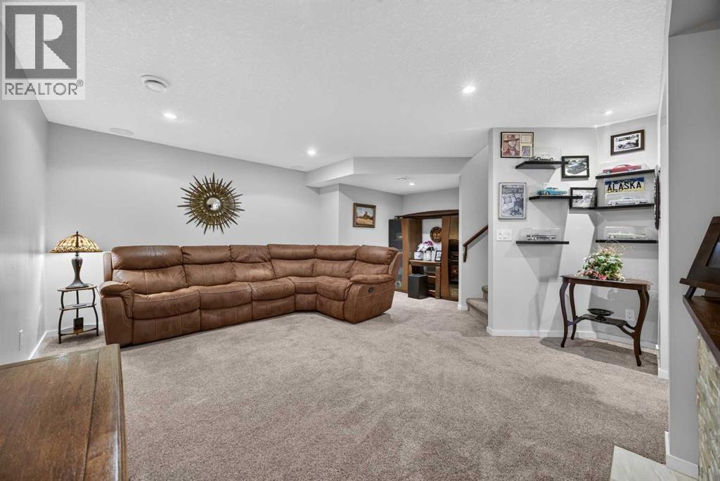 Downstairs living / media room with surround sound - perfect for cooling off and movie nights