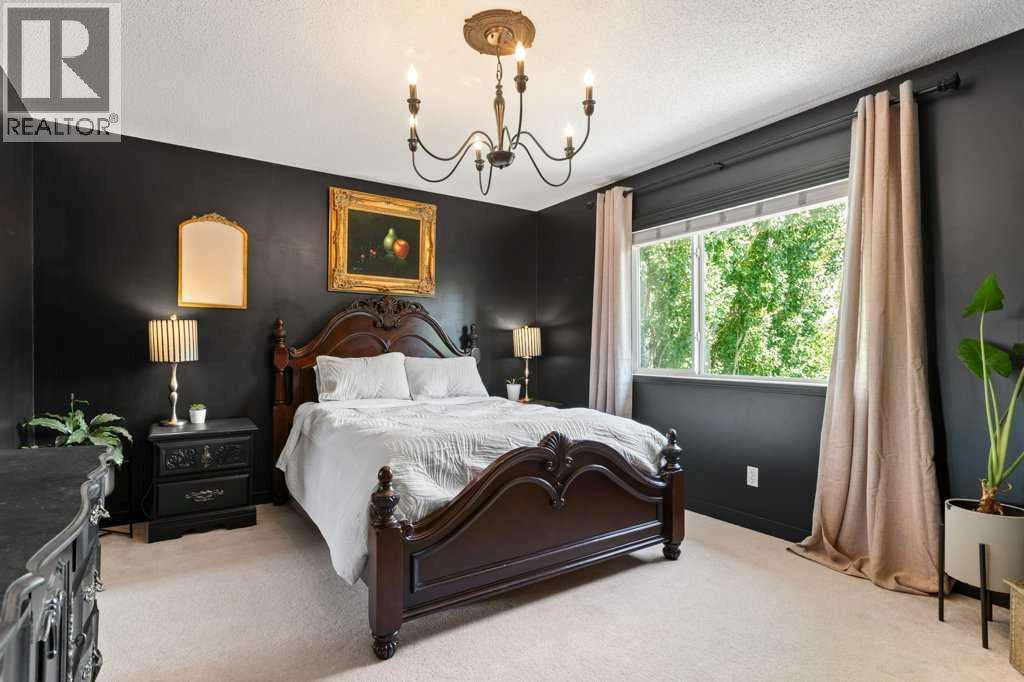 Large primary bedroom retreat with designer finishes, abundant natural light, and room for fullsized furniture