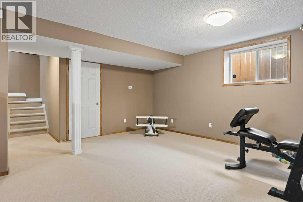 Large lower level recreation space ideal for a home gym, playroom, media room, or all three