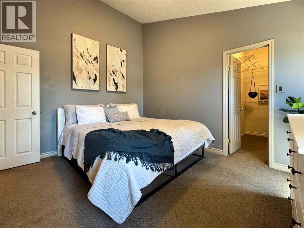 Primary Bedroom with Walk-in Closet and 4-pc Ensuite Bathroom