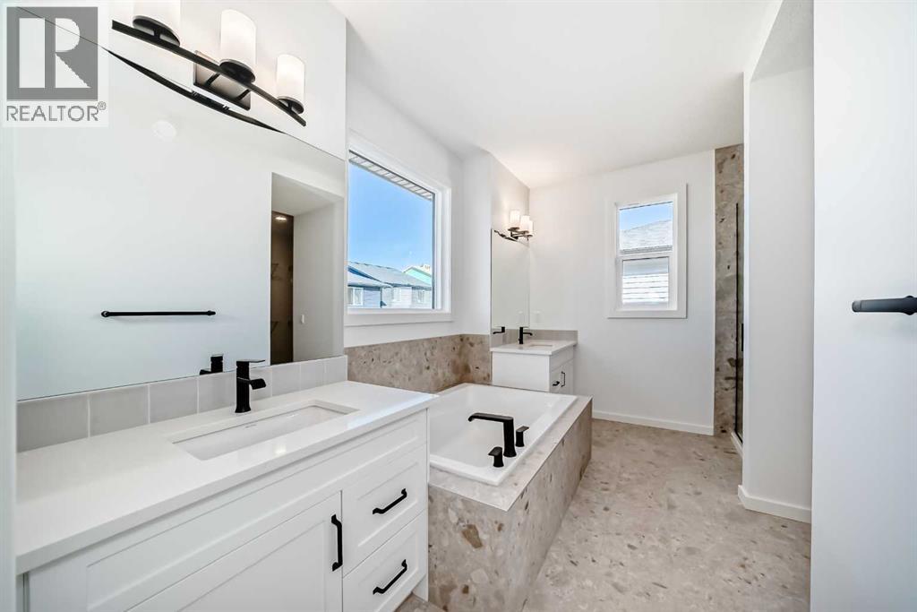 Master Ensuite • PLEASE NOTE: Photos are of a DIFFERENT Spec Home of the same model – fit and finish may differ. Interior selections and floorplans shown in photos