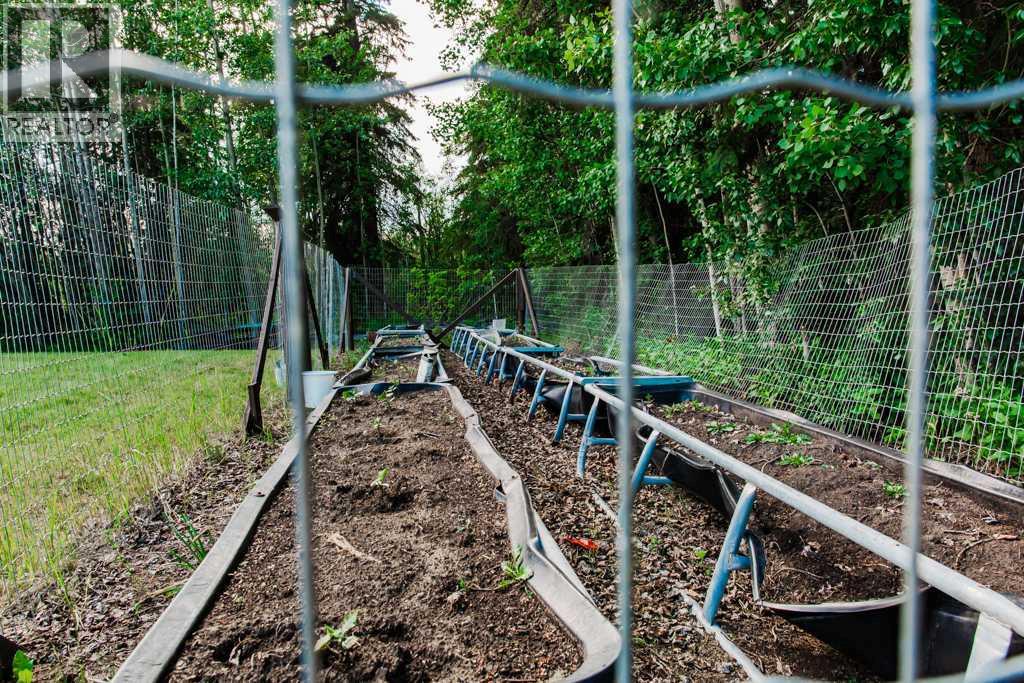 FENCED GARDEN SPOT WITH RAISED BEDS