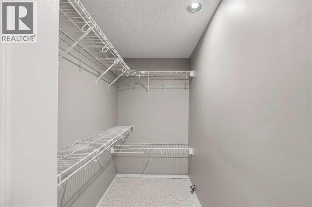Lower walk in closet virtually decluttered