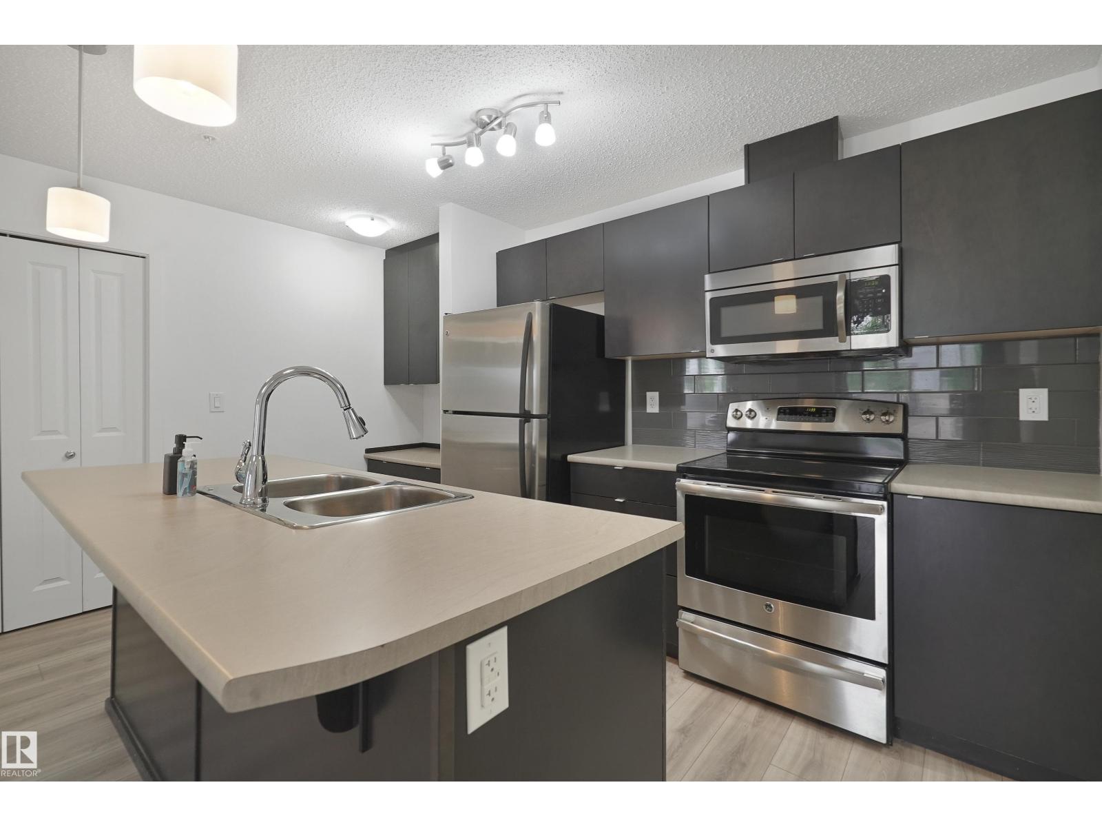 #114 3357 16A AV NW - 9