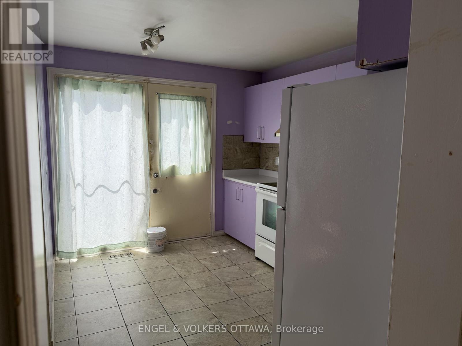 Kitchen with door to back yard