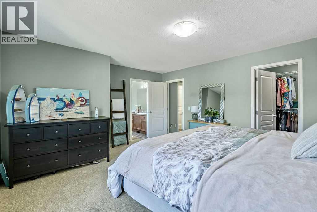 Generous in size and filled with natural light, the primary bedroom offers a peaceful place to unwind at the end of the day
