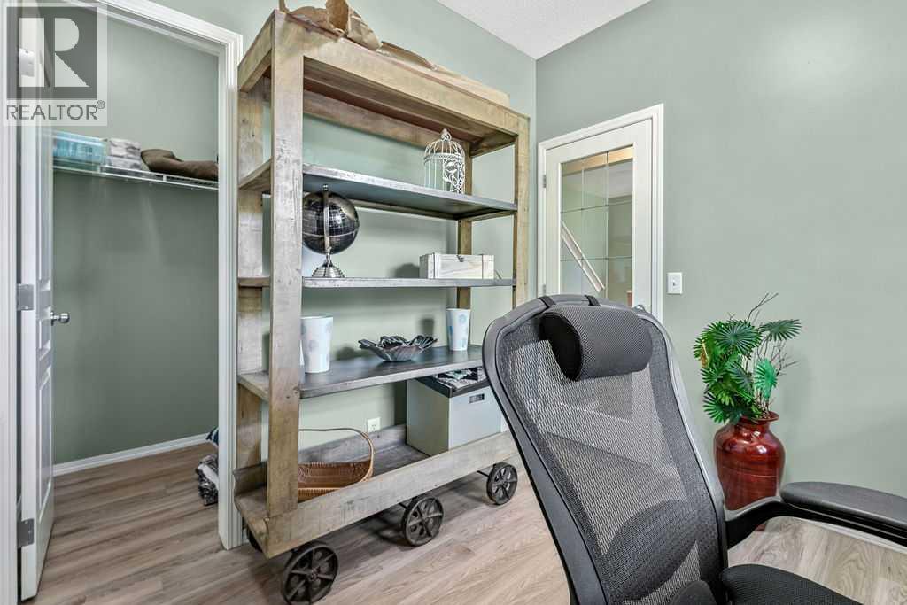 A rare main floor bedroom with a walk-in closet offers exceptional flexibility for guests, multigenerational living, or working from home