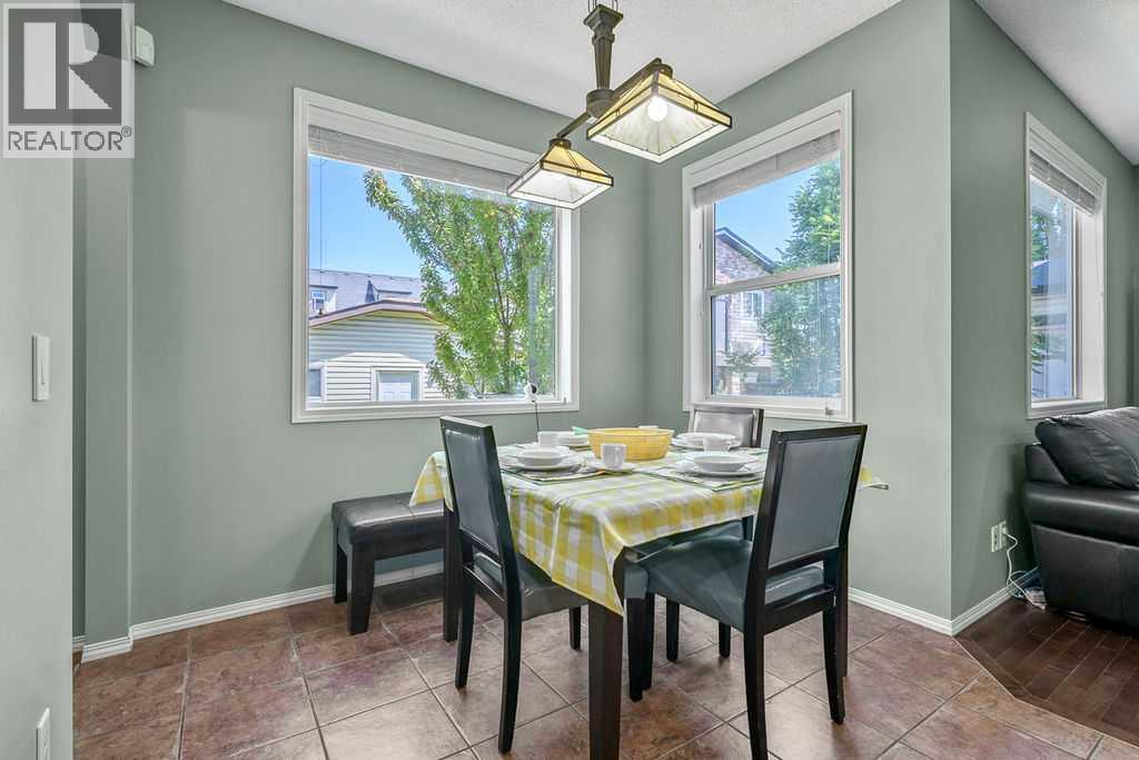 Bright and welcoming, the dining area overlooks the backyard and easily accommodates everyday meals or family gatherings