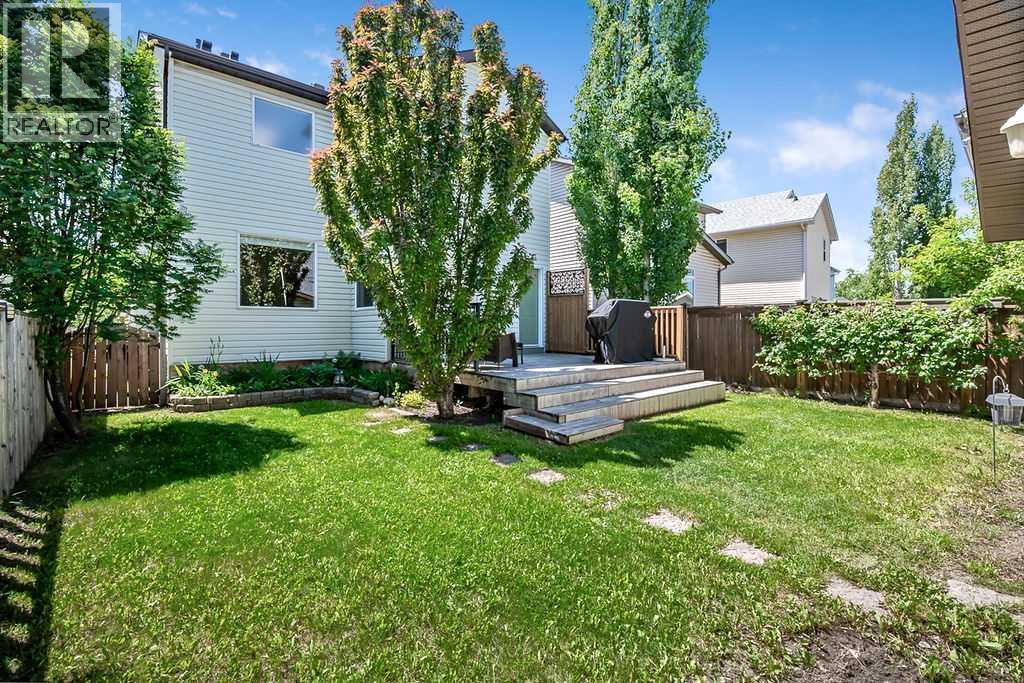 Enjoy your own private outdoor retreat featuring a spacious deck, mature trees, lush lawn, and an oversized double garage—perfect for relaxing, entertaining, gardening, or letting kids and pets play