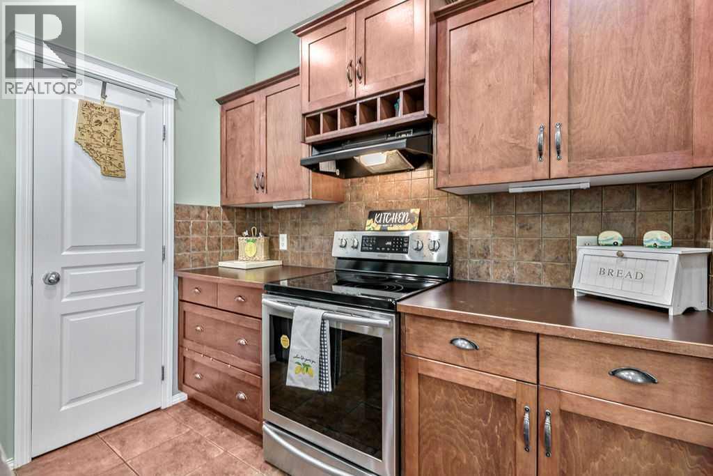 Plenty of prep space, deep drawers, upper wine storage, and timeless cabinetry create a kitchen built for both cooking and entertaining