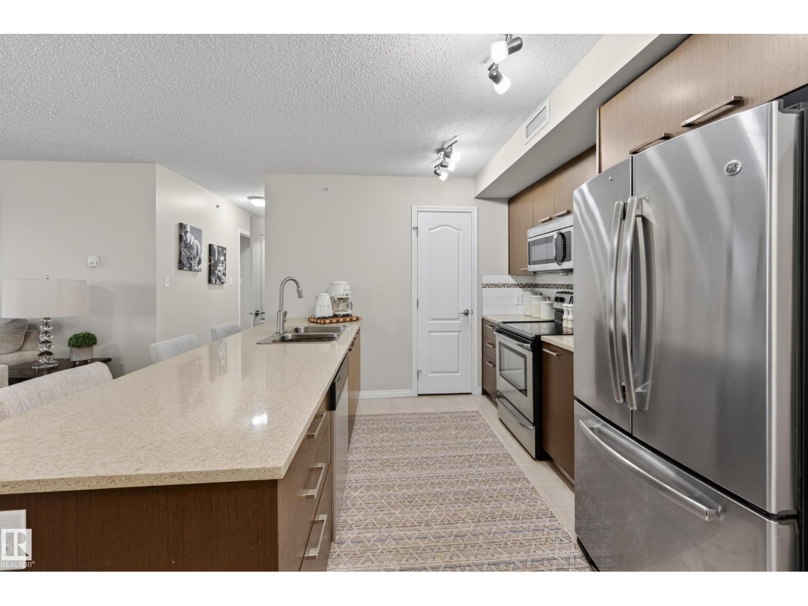#2402 7343 SOUTH TERWILLEGAR DR NW - 23
