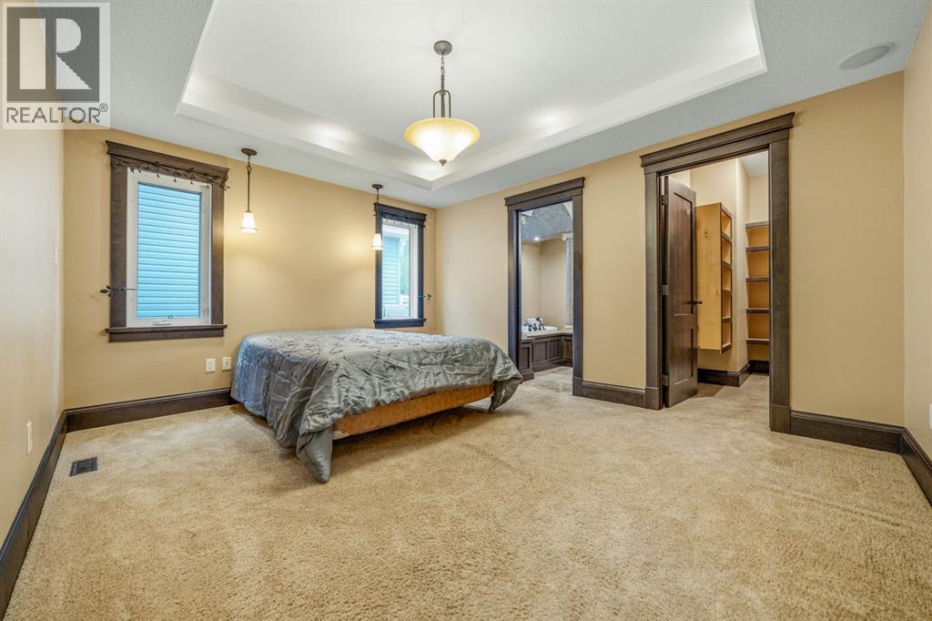 Spacious primary bedroom with custom walk in closet and elegant 5 piece ensuite (separate shower)